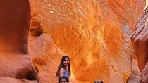 Guided tours in southern Utahs slot canyons, Indian ruins, and national parks. 