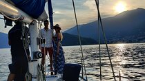 Sunset sailing on lake Como with Private Skipper