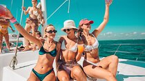 Wild adult catamaran party sailing to Isla Mujeres