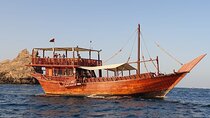 Omani Traditional Dhow Cruise: Sunset and Muscat Coastal View