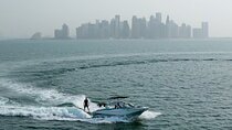 Private Wakesurfing or Wakeboarding along Doha's skyline