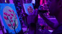 Paint a neon fluorescent picture while drinking unlimited wine