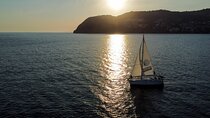 Sailing at sunset along the cliffs of Maro-Compartida