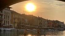 Sup experience with a ride to Peschiera del Garda Lake Garda