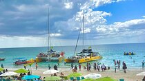 7 Mile Beach Party Catamaran Cruise with Snorkeling & Ricks Cafe 