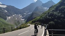 Alpine Pass Descent: Downhill Cycling Adventure in the Swiss Alps