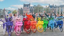 Explore Amsterdam canals on iconic Flower Bikes