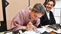 Learning Zen of Japanese Calligraphy in kimono near Osaka Castle
